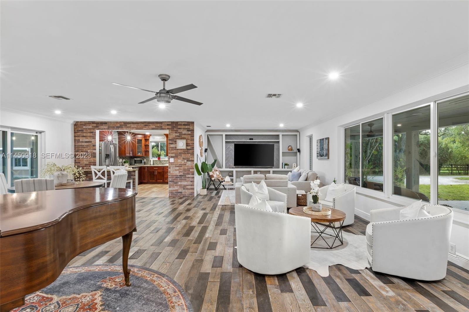 6410 Melaleuca Road Southwest Ranches, FL 33330 - Photo 5 of 50 a living room with furniture and a flat screen tv