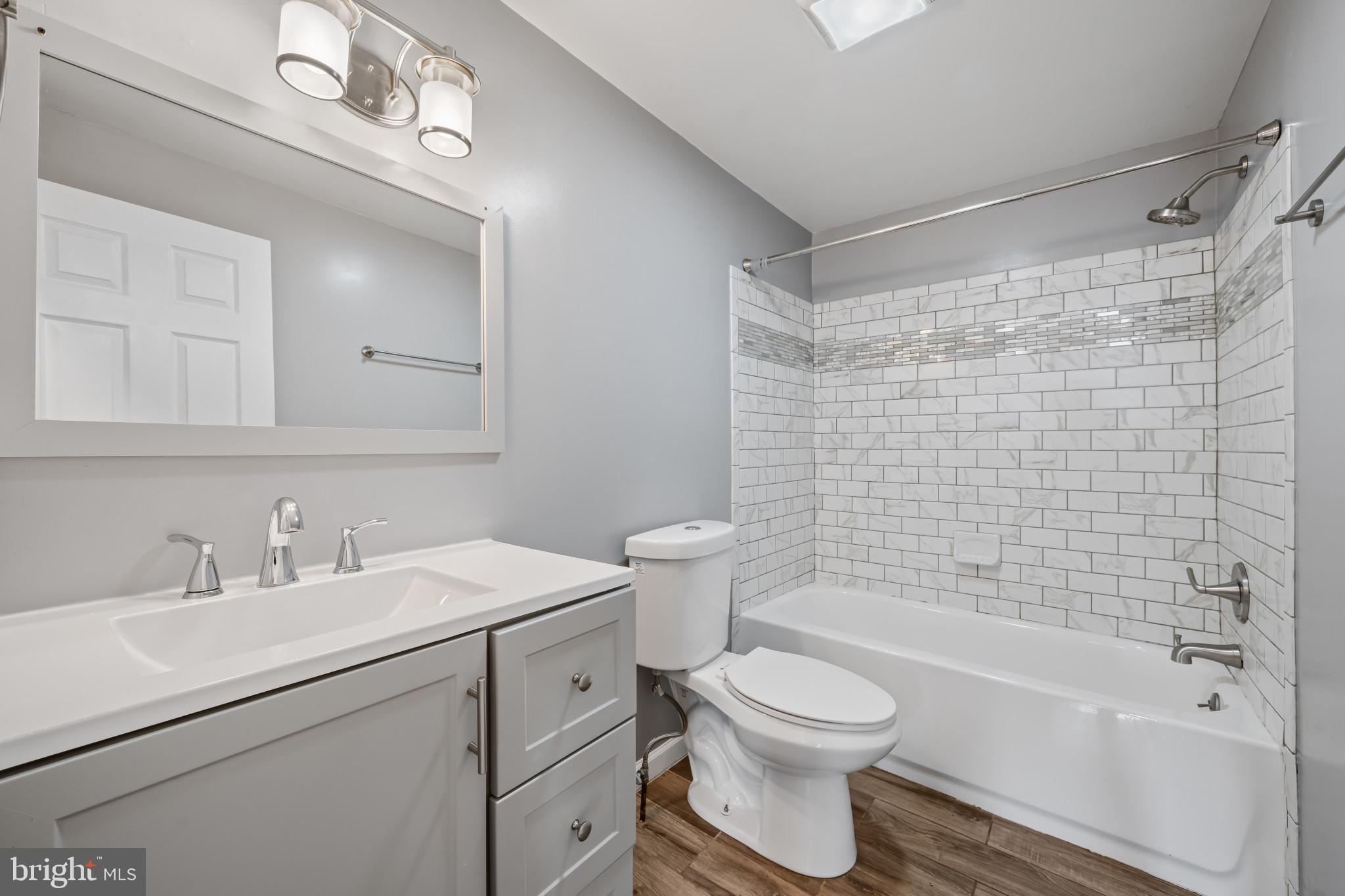 628 Savage Street Baltimore, MD 21224 - Photo 17 of 45 a bathroom with a sink toilet and shower
