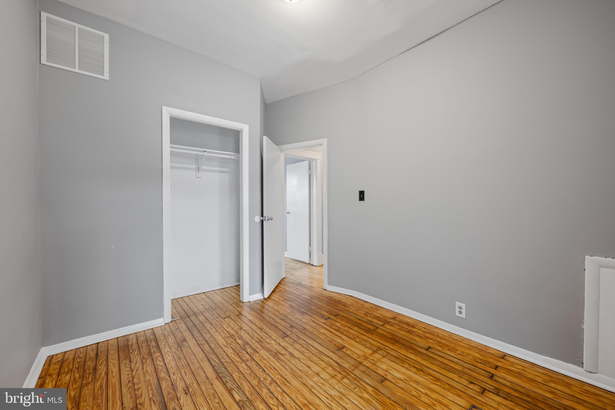 628 Savage Street Baltimore, MD 21224 - Photo 20 of 45 a view of a room with wooden floor and closet