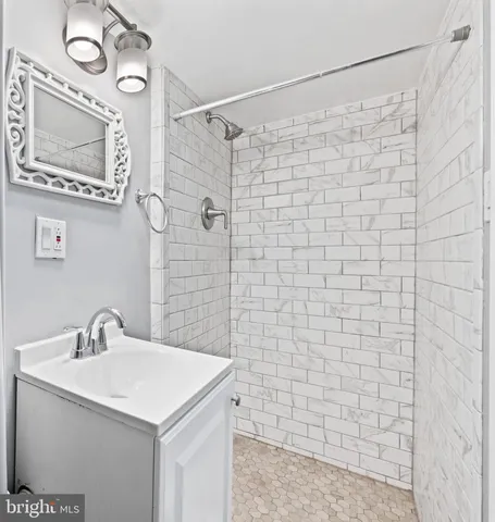 a view of an empty room with white walls