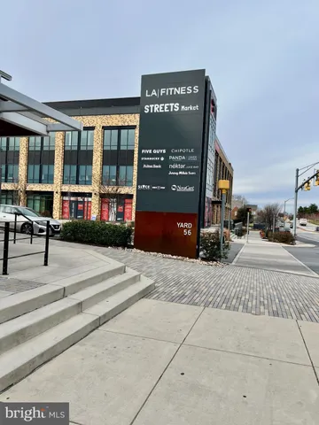 a view of a building with sitting area