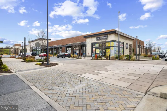 a view of an empty room and a window