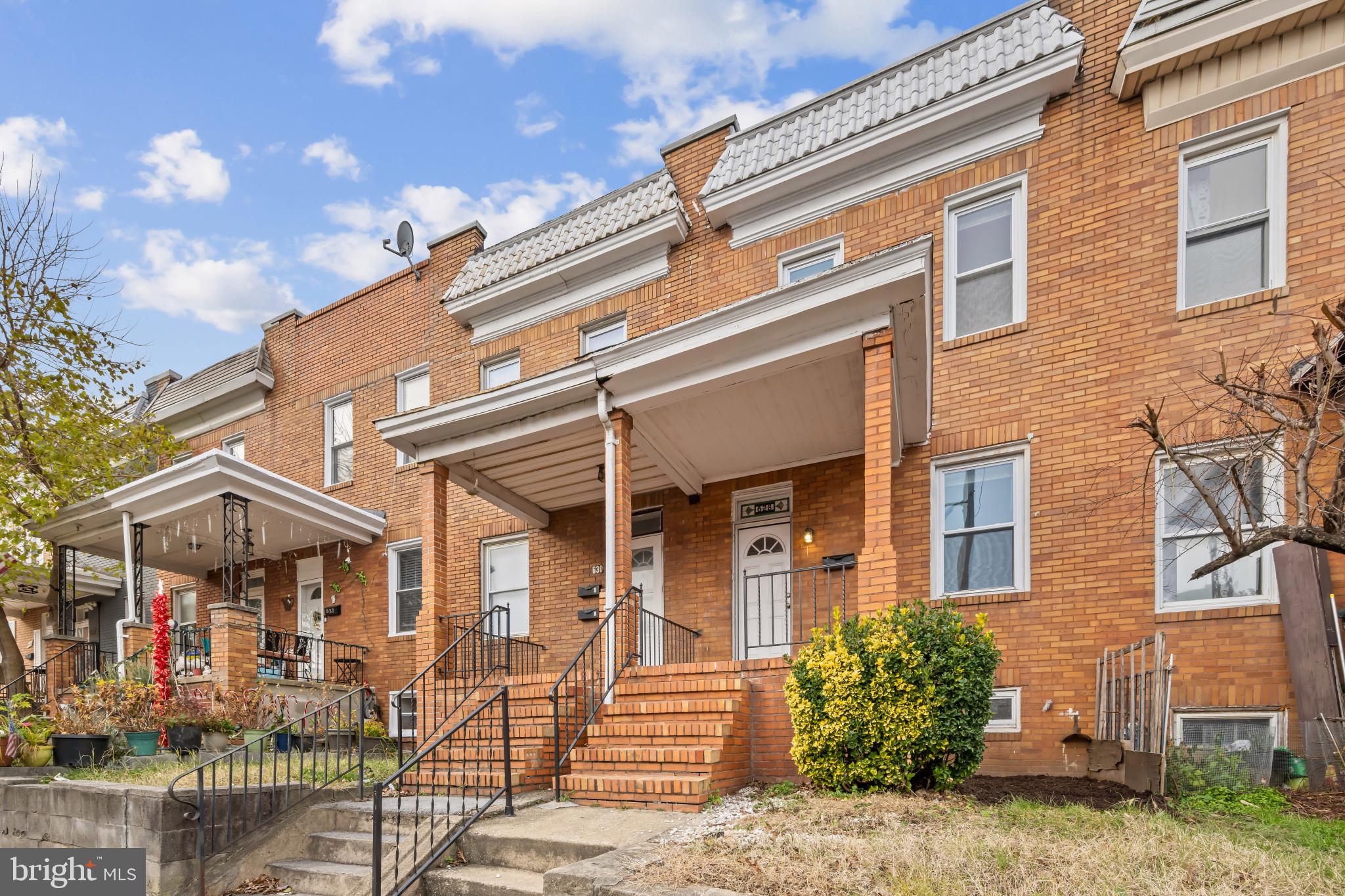 628 Savage Street Baltimore, MD 21224 - Photo 42 of 45 a front view of a building with garden