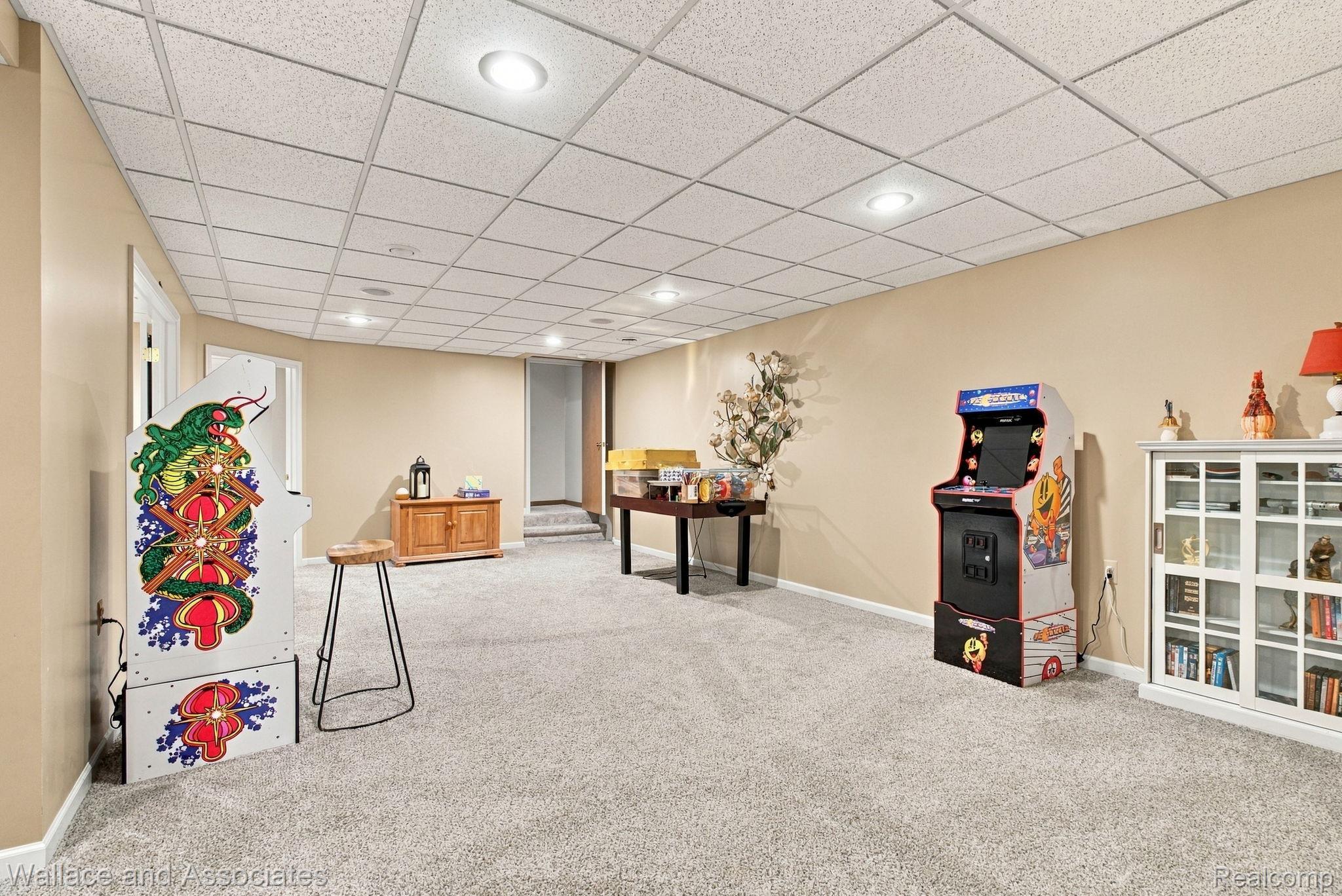 17076 27 Mile Road Ray, MI 48096 - Photo 38 of 63 Recessed lighting, light-toned carpeting, and a grid ceiling panel system