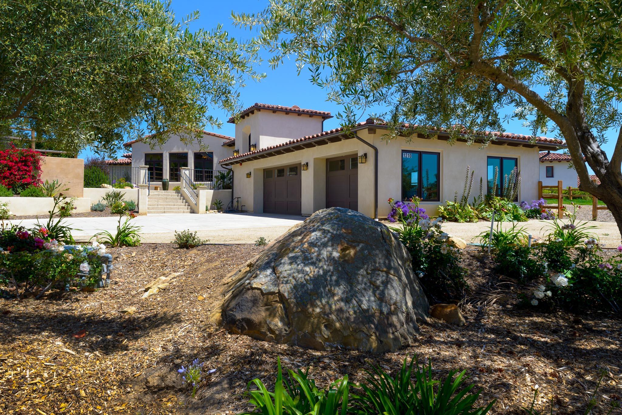 1210 Via Brigitte Santa Barbara, CA 93111 - Photo 13 of 15 a front view of a house with a yard and trees
