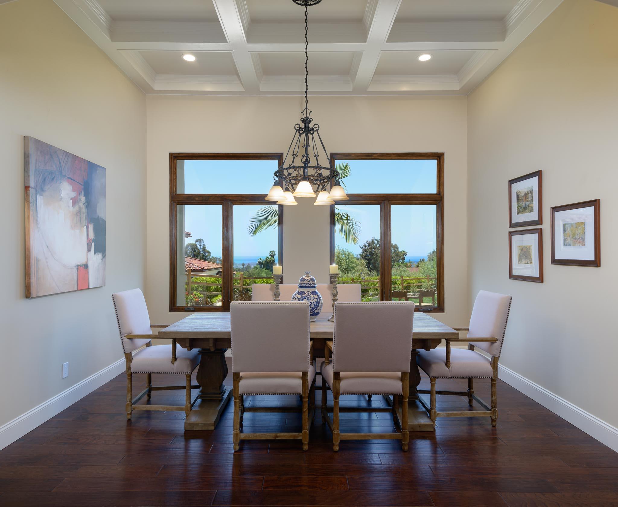 1210 Via Brigitte Santa Barbara, CA 93111 - Photo 9 of 15 a dining room with wooden floor a chandelier a glass table and chairs