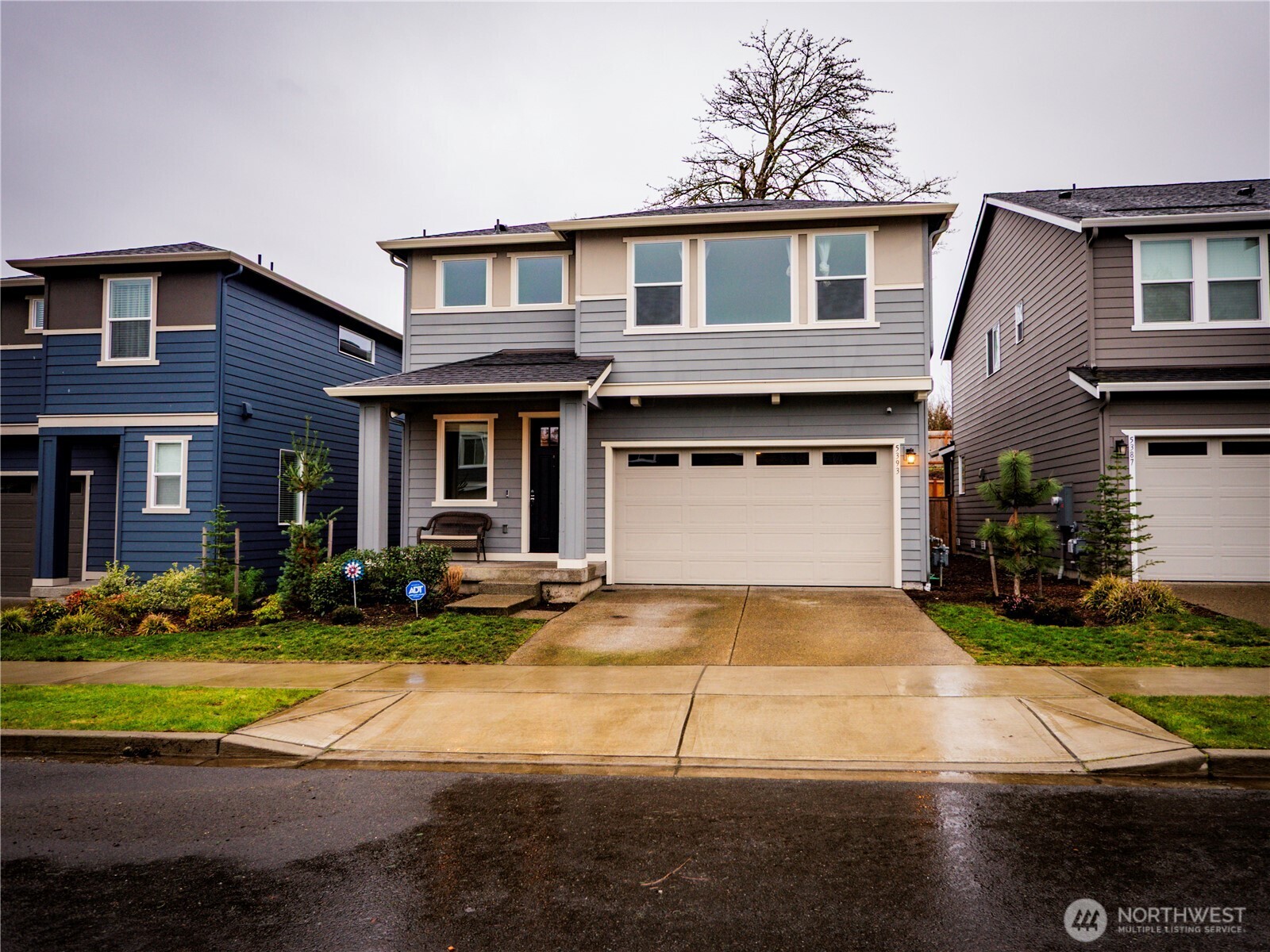 5393 Century Place Northeast Lacey, WA 98516 - Photo 1 of 33 a view of a white house with large windows next to a yard