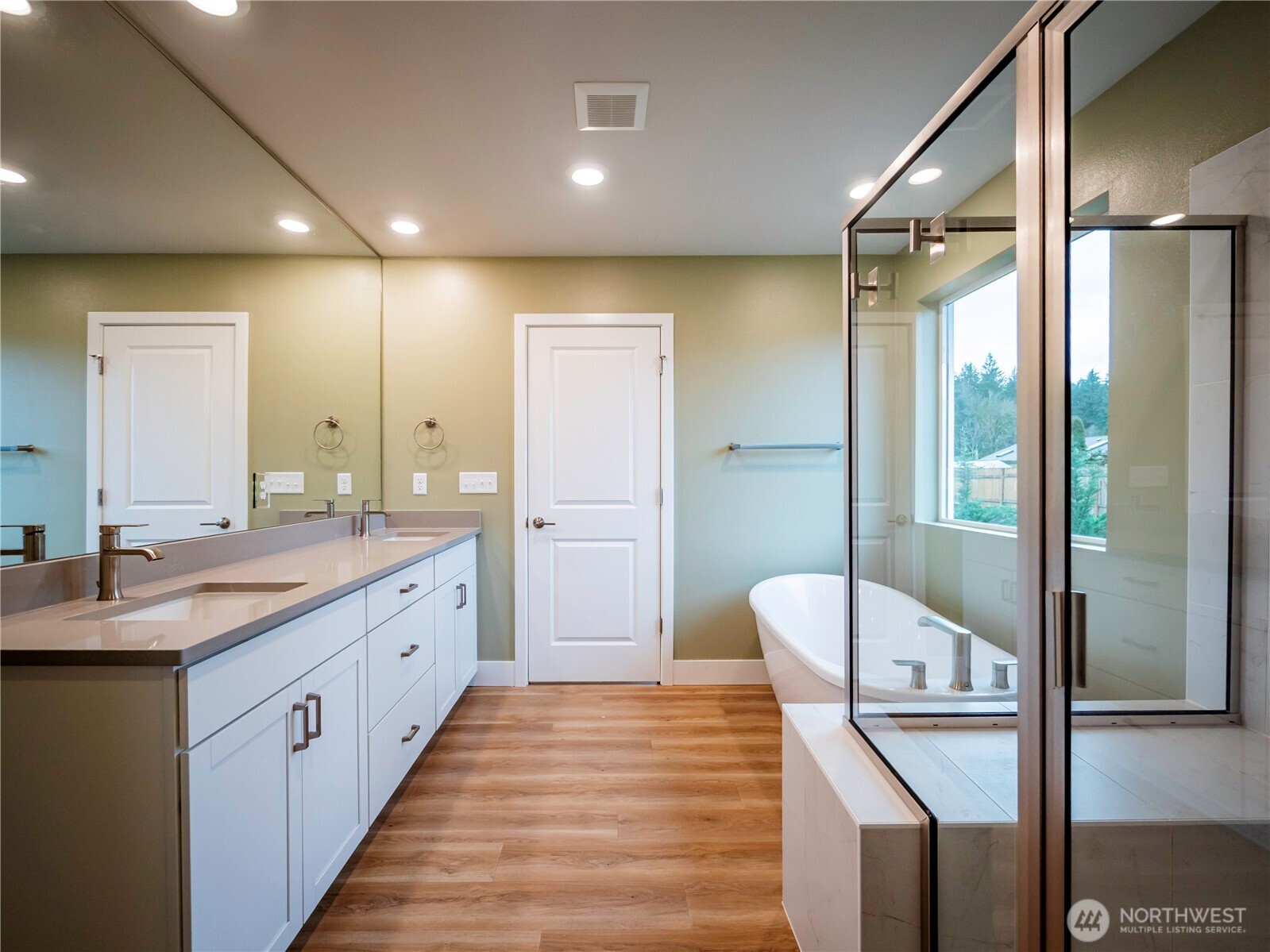 5393 Century Place Northeast Lacey, WA 98516 - Photo 29 of 33 a large bathroom with a double vanity sink a large mirror and a shower
