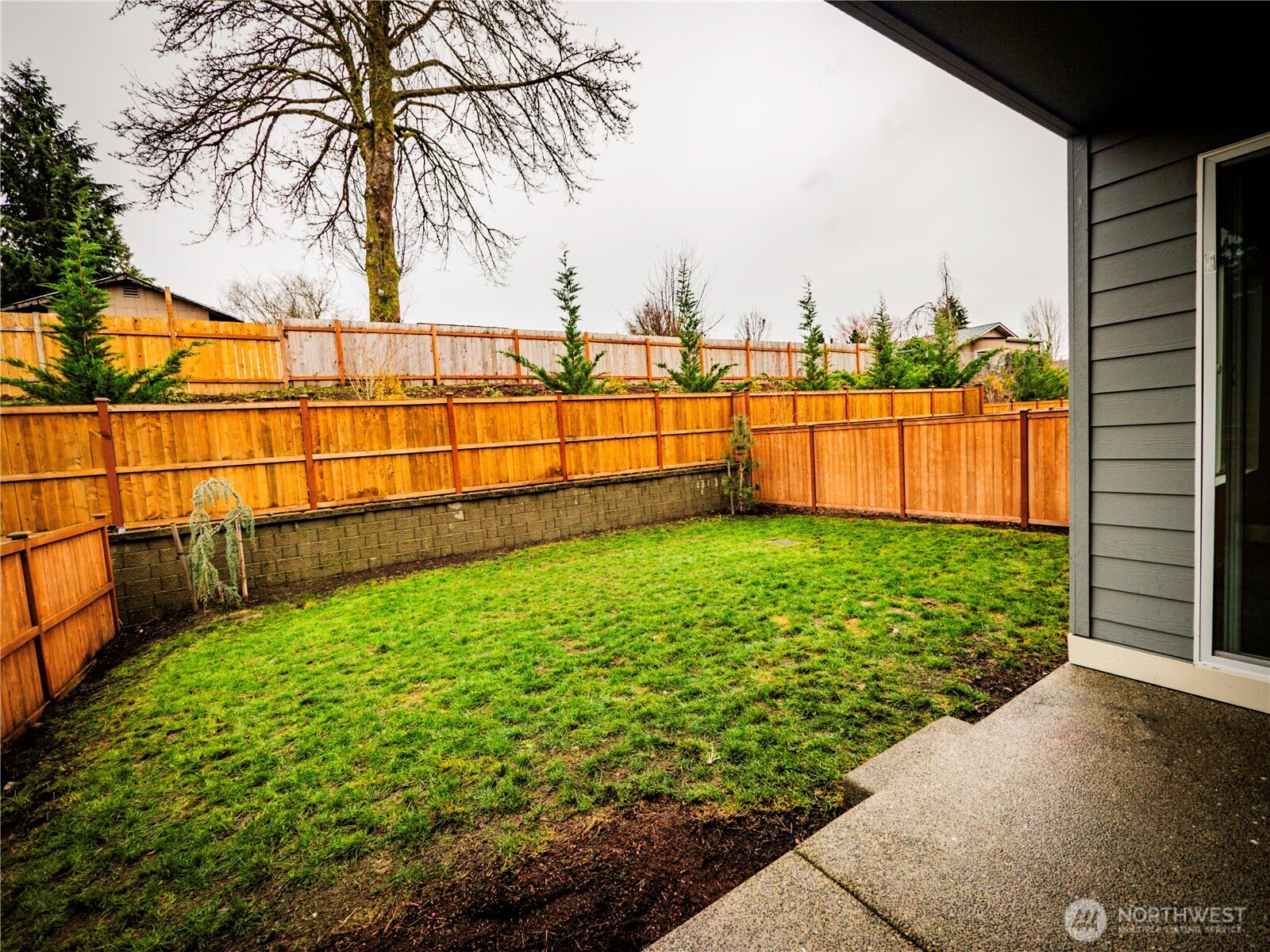 5393 Century Place Northeast Lacey, WA 98516 - Photo 31 of 33 a view of a garden with a building in the background