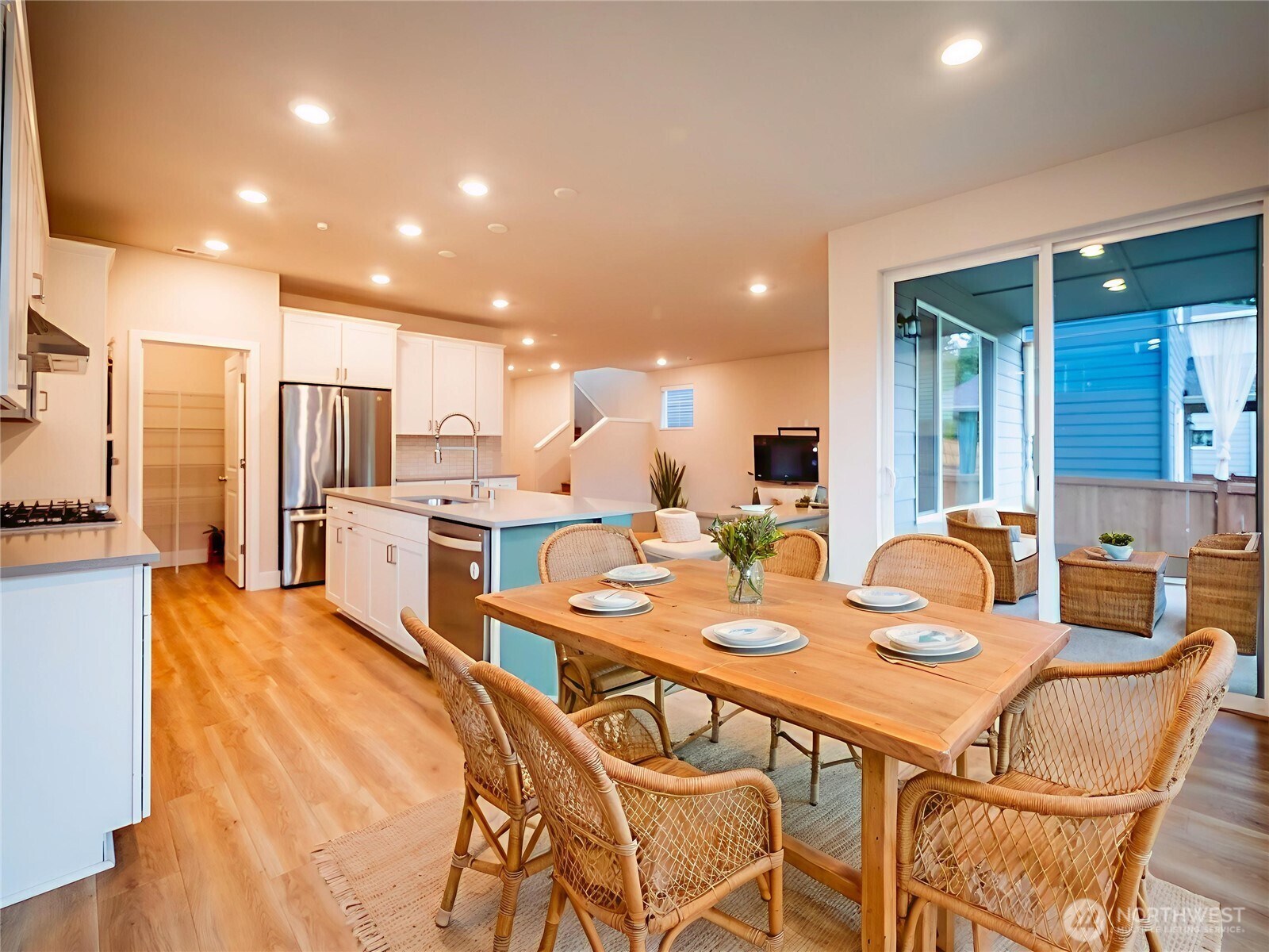 5393 Century Place Northeast Lacey, WA 98516 - Photo 4 of 33 a dining room with stainless steel appliances kitchen island granite countertop a table chairs and a refrigerator
