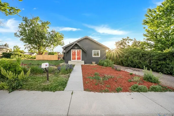 a front view of a house with yard
