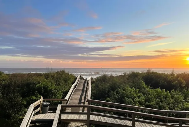 a view of a lake with a table and chairs