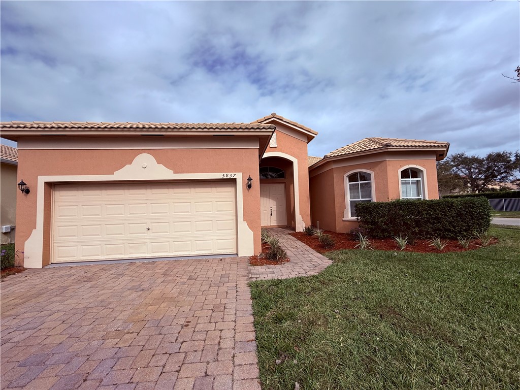 5837 Spanish River Road Fort Pierce, FL 34951 - Photo 1 of 34 a house view with a backyard space