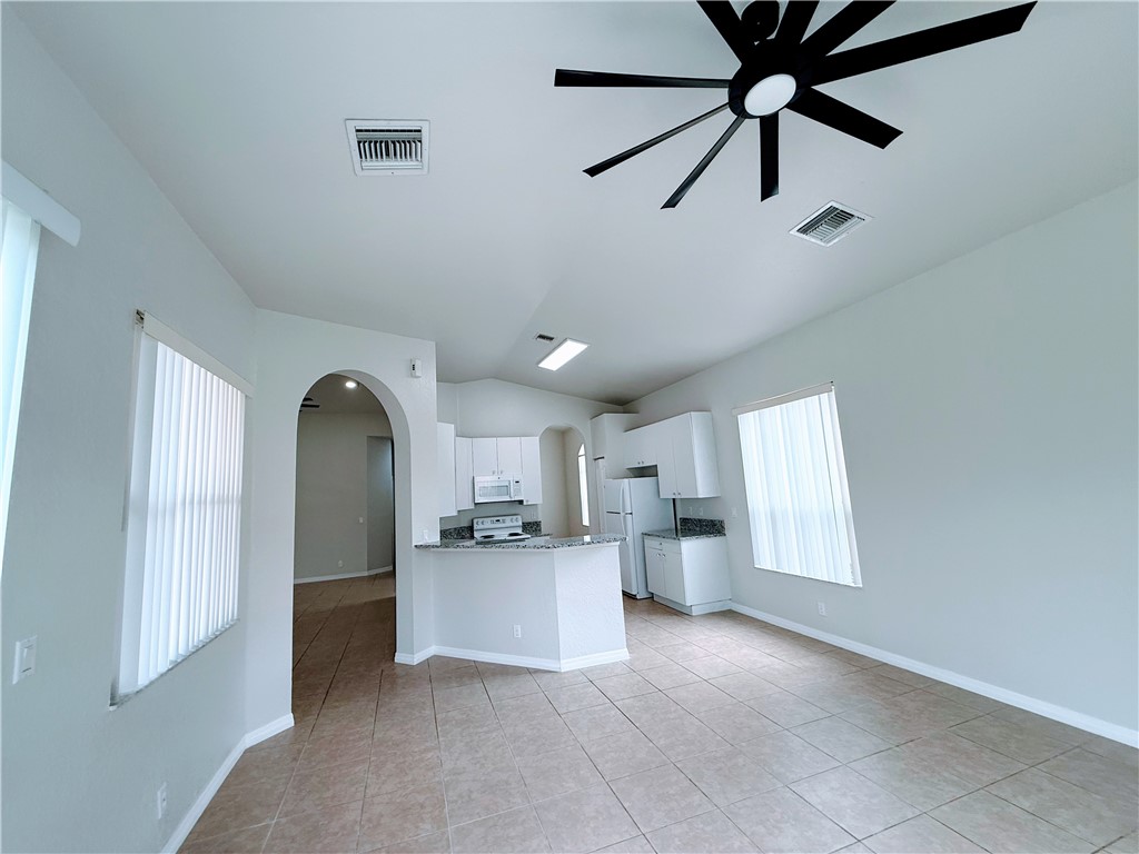 5837 Spanish River Road Fort Pierce, FL 34951 - Photo 11 of 34 a view of a kitchen with a sink and dishwasher cabinets