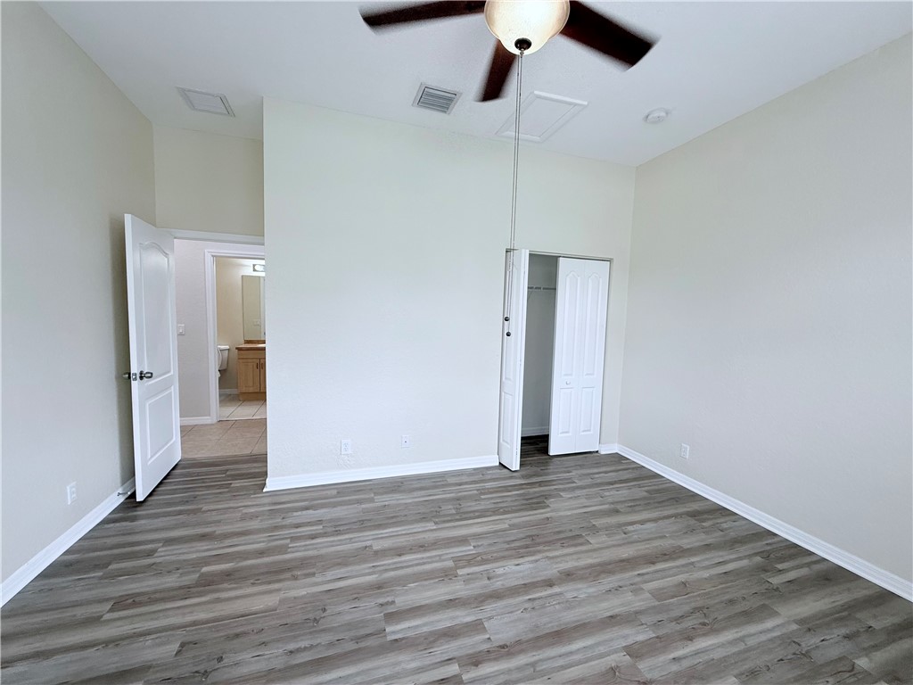 5837 Spanish River Road Fort Pierce, FL 34951 - Photo 15 of 34 a view of an empty room with wooden floor