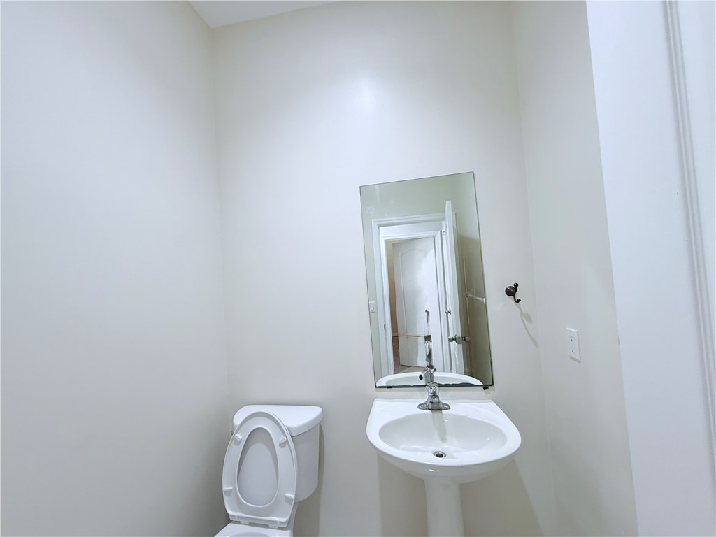 5837 Spanish River Road Fort Pierce, FL 34951 - Photo 25 of 34 a bathroom with a sink and a mirror