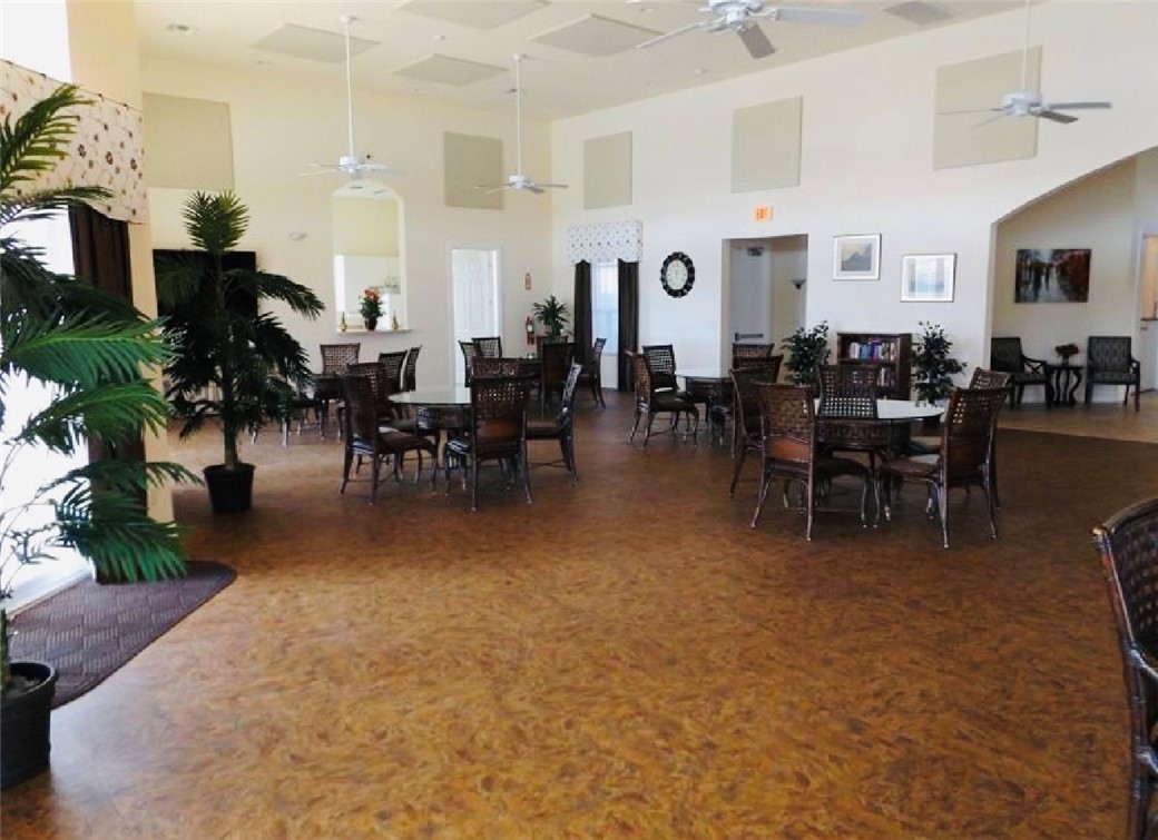 5837 Spanish River Road Fort Pierce, FL 34951 - Photo 29 of 34 a living room with lots of furniture and a chandelier