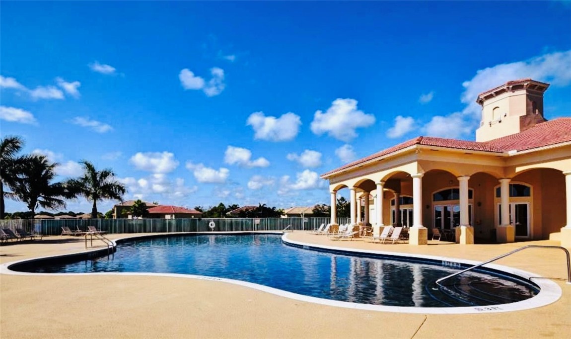 5837 Spanish River Road Fort Pierce, FL 34951 - Photo 31 of 34 a view of a swimming pool with outdoor seating