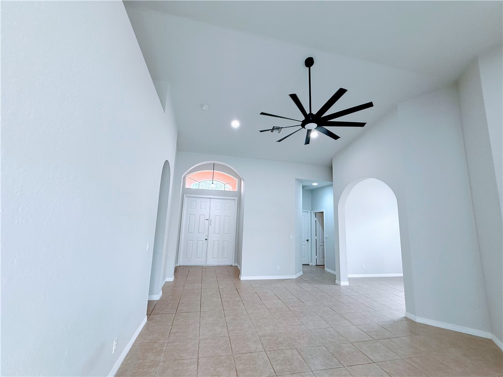 5837 Spanish River Road Fort Pierce, FL 34951 - Photo 4 of 34 a view of a livingroom with a ceiling fan and window