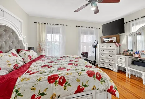 a bedroom with a bed and a dresser