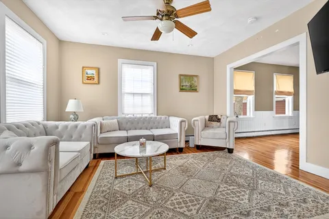 a living room with furniture and a window
