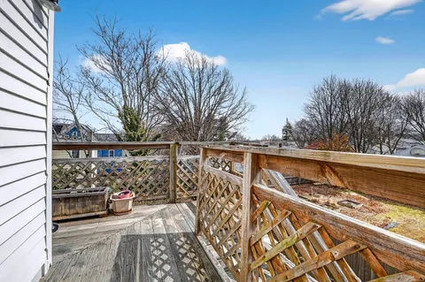 a view of balcony with wooden floor