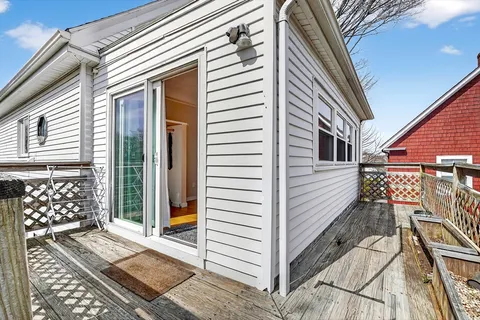 a view of a house with a door and wooden floor