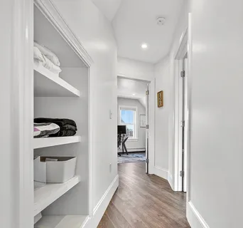 a view of a hallway with a bedroom