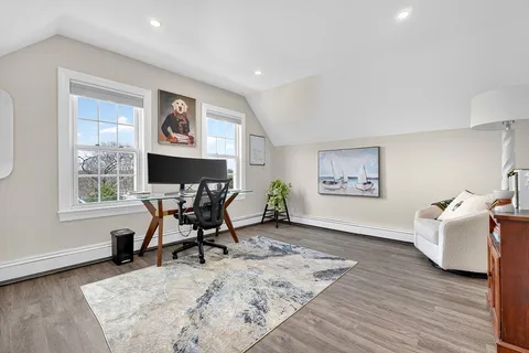 a workspace with furniture and a window