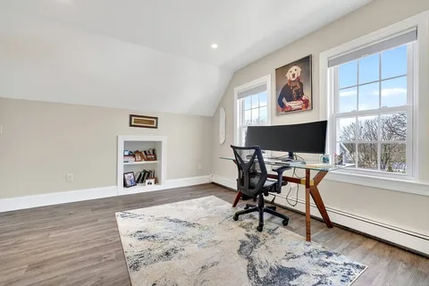 a workspace with furniture and a window