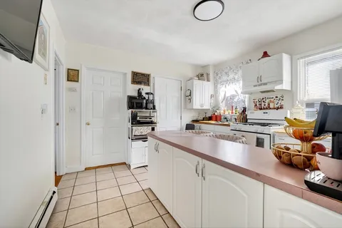 a kitchen with cabinets and a sink