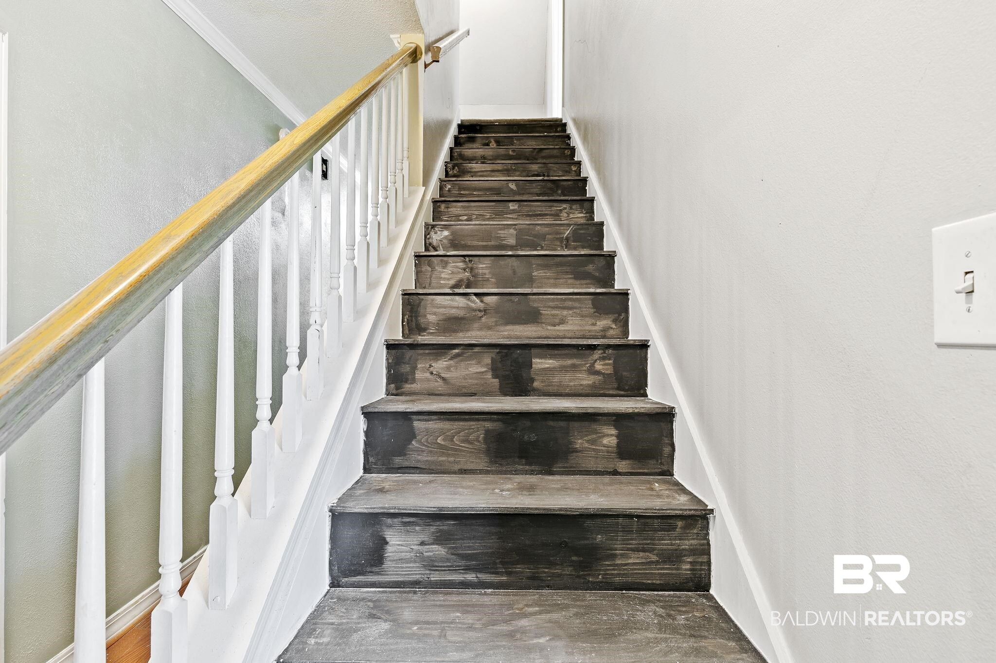 474 Ridgewood Drive Daphne, AL 36526 - Photo 35 of 57 Stairs with hardwood / wood-style flooring and ornamental molding