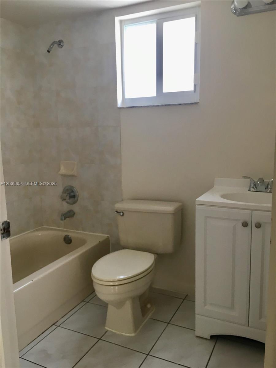 1419 Southwest 22nd Avenue Miami, FL 33145 - Photo 18 of 20 a white toilet sitting next to a bath tub