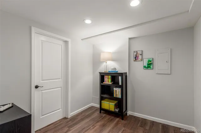 a view of room with wooden floor and closet