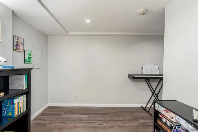 a view of room with window and wooden floor