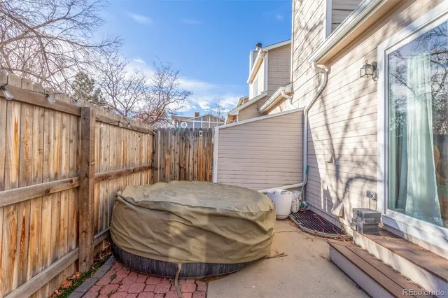 a view of a two chairs in the balcony