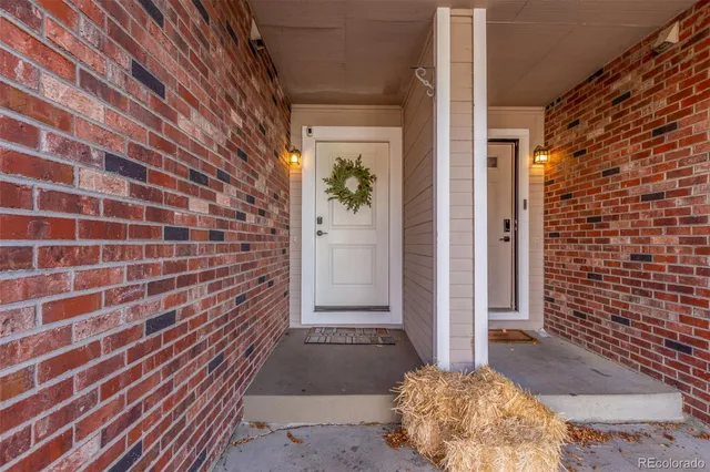 a view of a brick house with an outdoor space