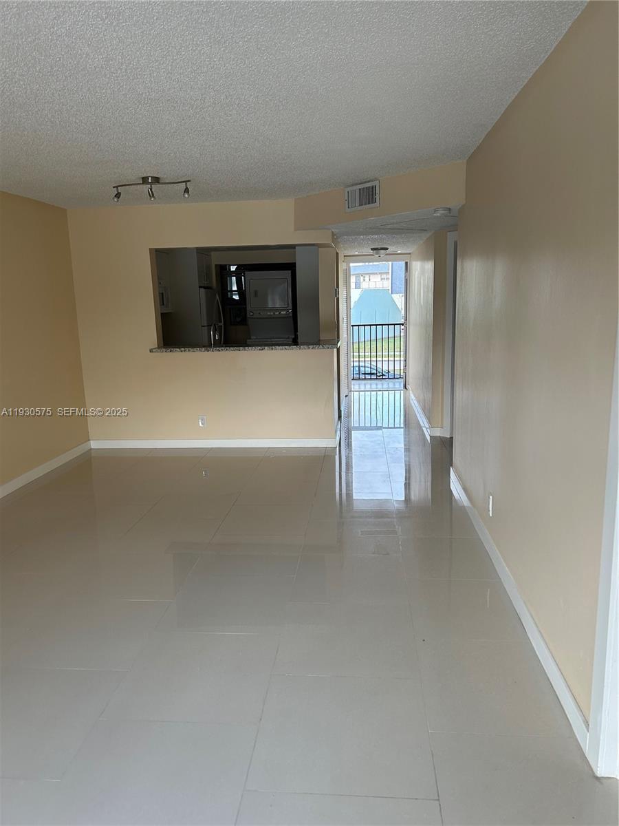 7910 North Colony Circle, Unit 209 Tamarac, FL 33321 - Photo 12 of 19 a view of empty room
