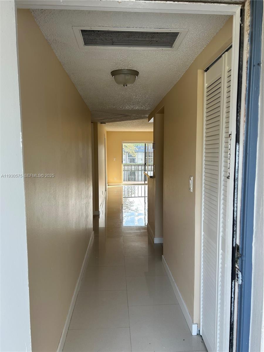 7910 North Colony Circle, Unit 209 Tamarac, FL 33321 - Photo 2 of 19 a view of entryway