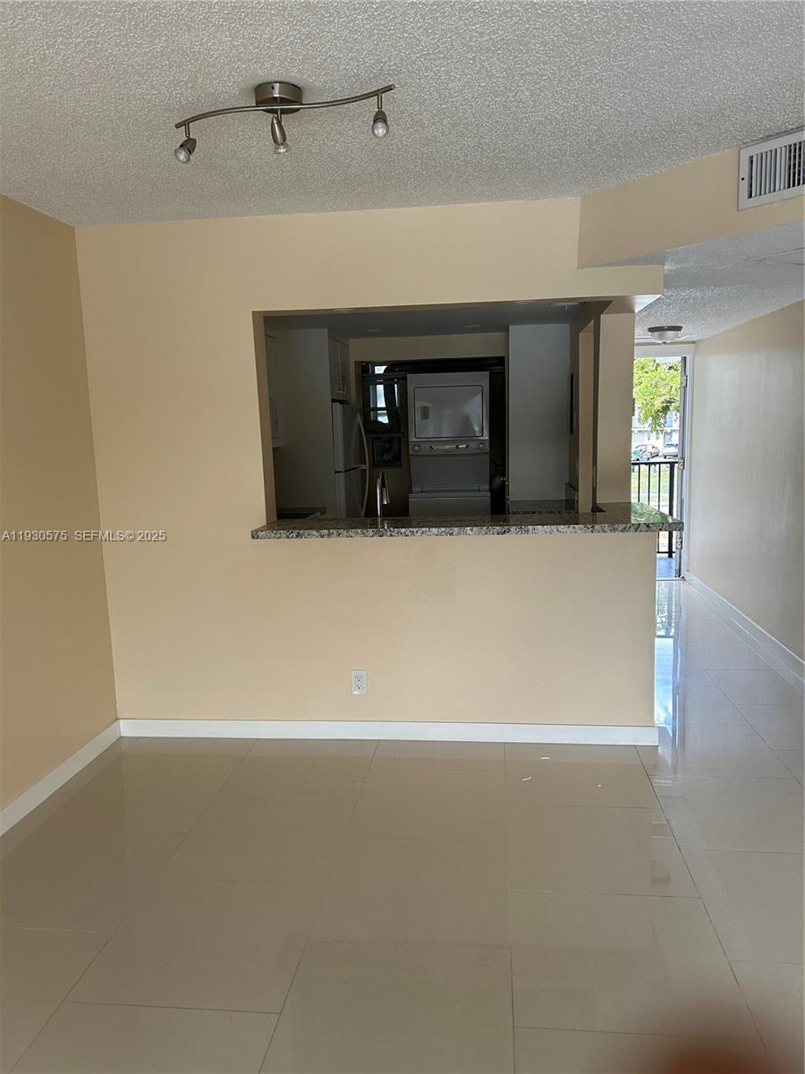 7910 North Colony Circle, Unit 209 Tamarac, FL 33321 - Photo 6 of 19 a view of a livingroom with a fireplace