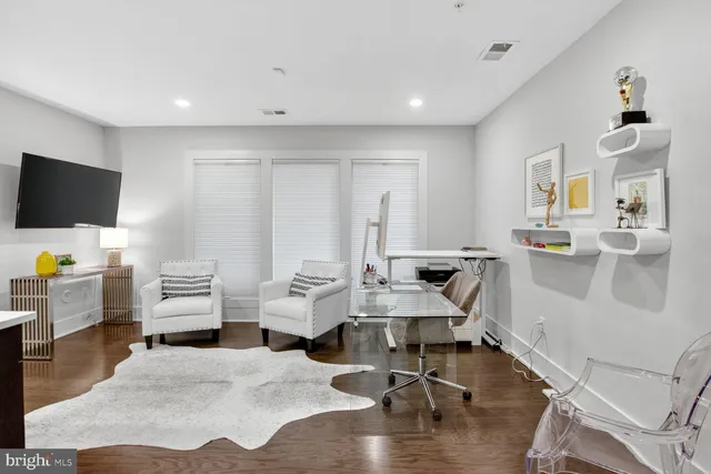 a living room with furniture window and a table