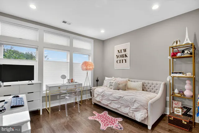 a patio with couches and a fireplace