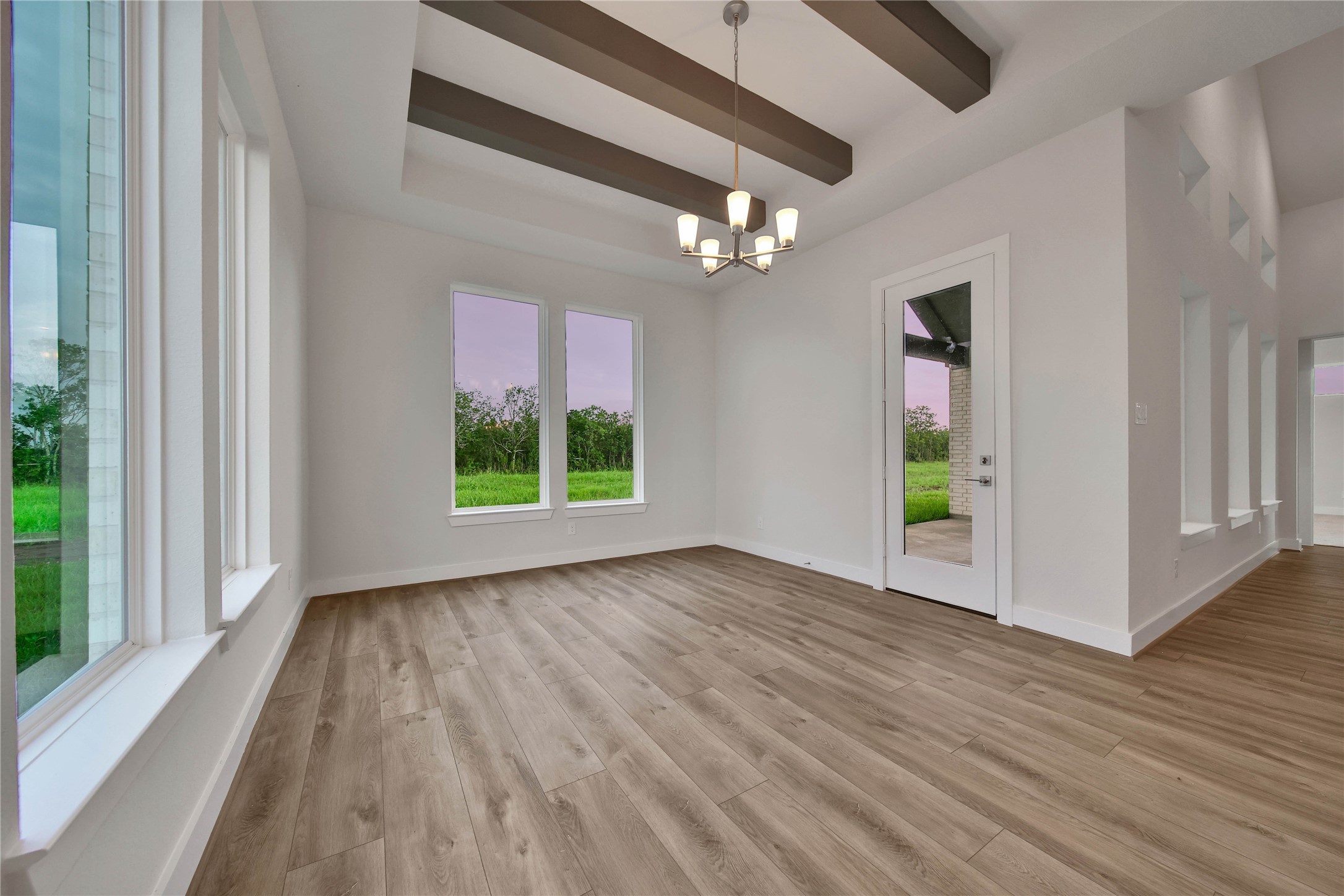 4602 Magnolia Bend Drive Rosharon, TX 77583 - Photo 13 of 39 wooden floor in an empty room with a window