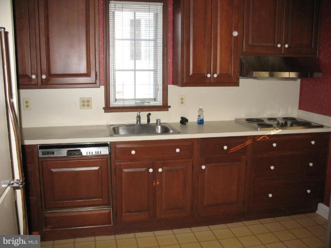 611 Worcester Road Towson, MD 21286 - Photo 14 of 24 a kitchen with a sink and cabinets