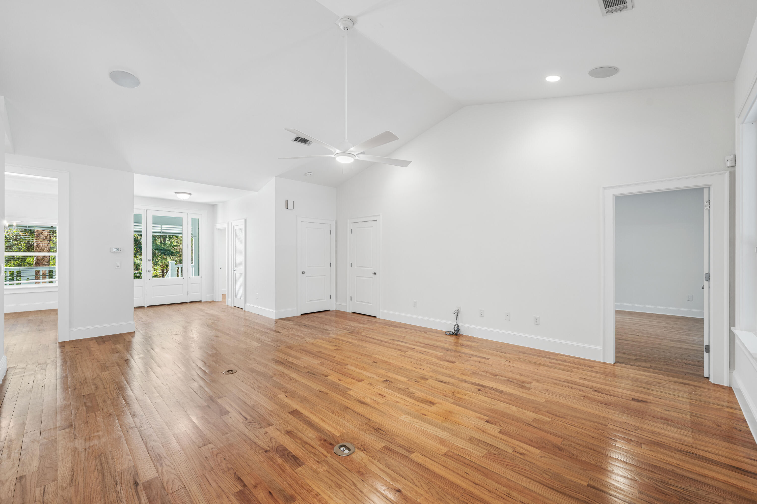 611 Amelia Lane Santa Rosa Beach, FL 32459 - Photo 11 of 59 an empty room with wooden floor and windows