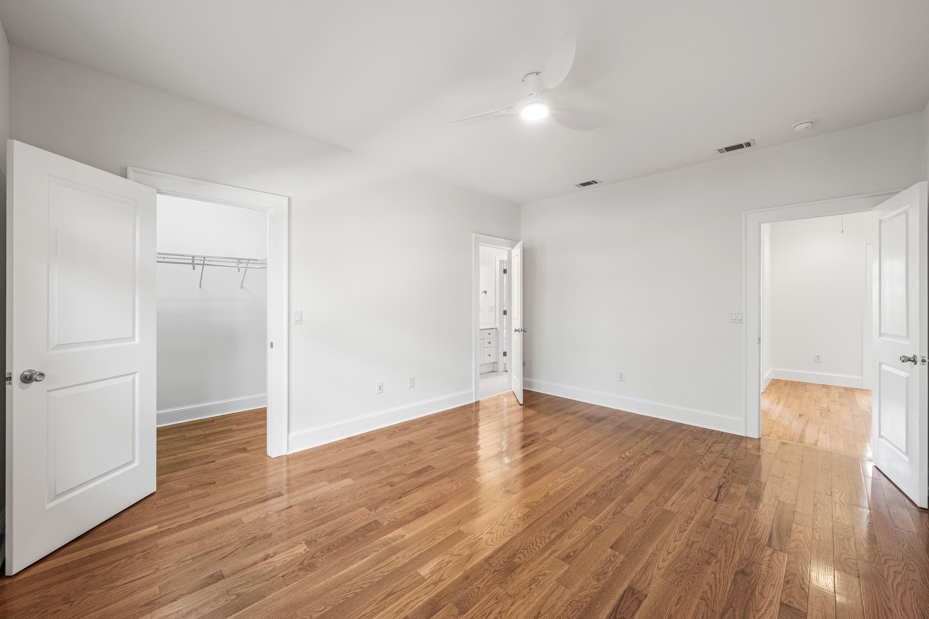 611 Amelia Lane Santa Rosa Beach, FL 32459 - Photo 28 of 59 an empty room with wooden floor & windows