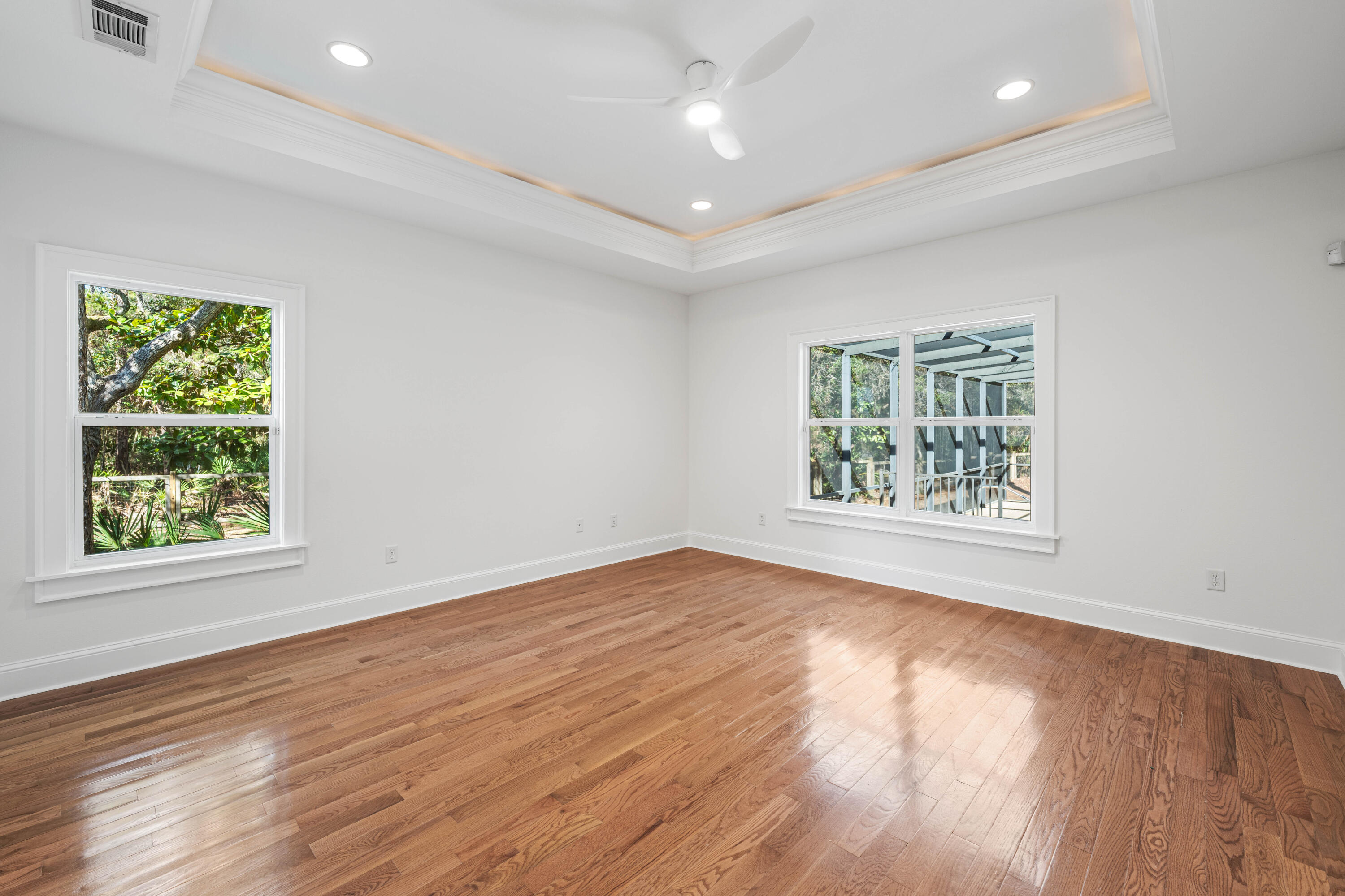 611 Amelia Lane Santa Rosa Beach, FL 32459 - Photo 36 of 59 an empty room with wooden floor and windows