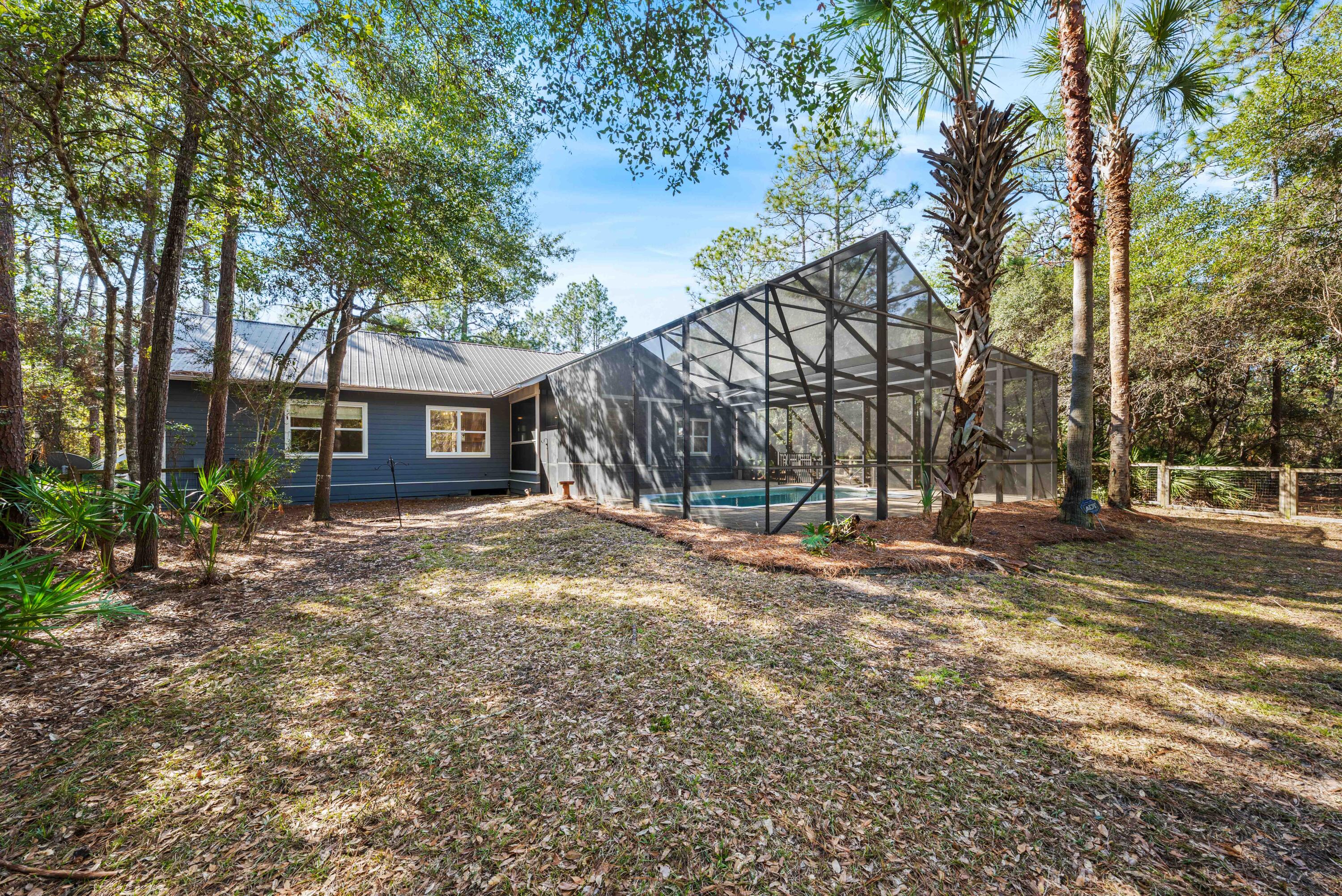 611 Amelia Lane Santa Rosa Beach, FL 32459 - Photo 45 of 59 a view of a house with a yard and tree s