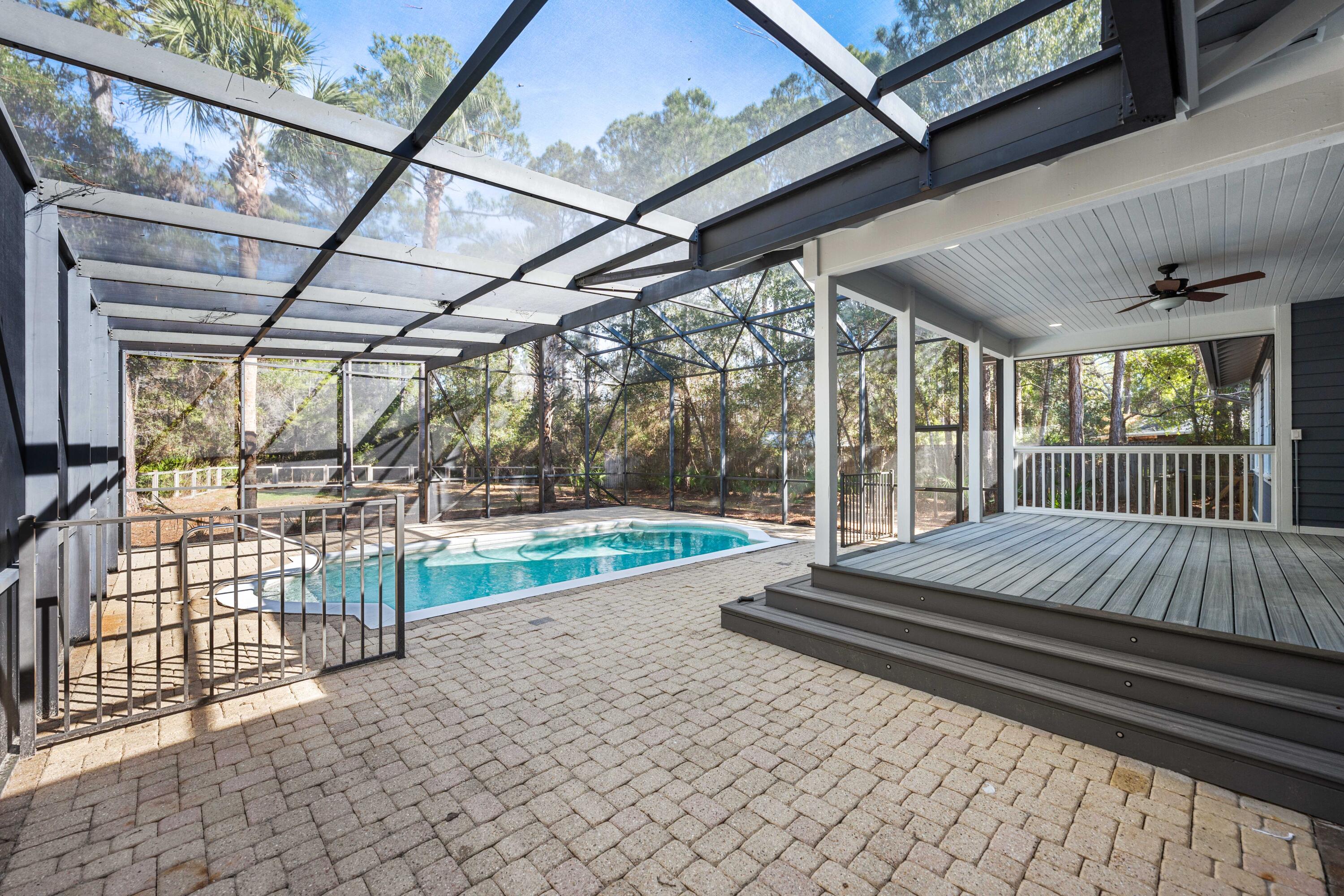 611 Amelia Lane Santa Rosa Beach, FL 32459 - Photo 47 of 59 a bed sitting in a balcony next to a yard