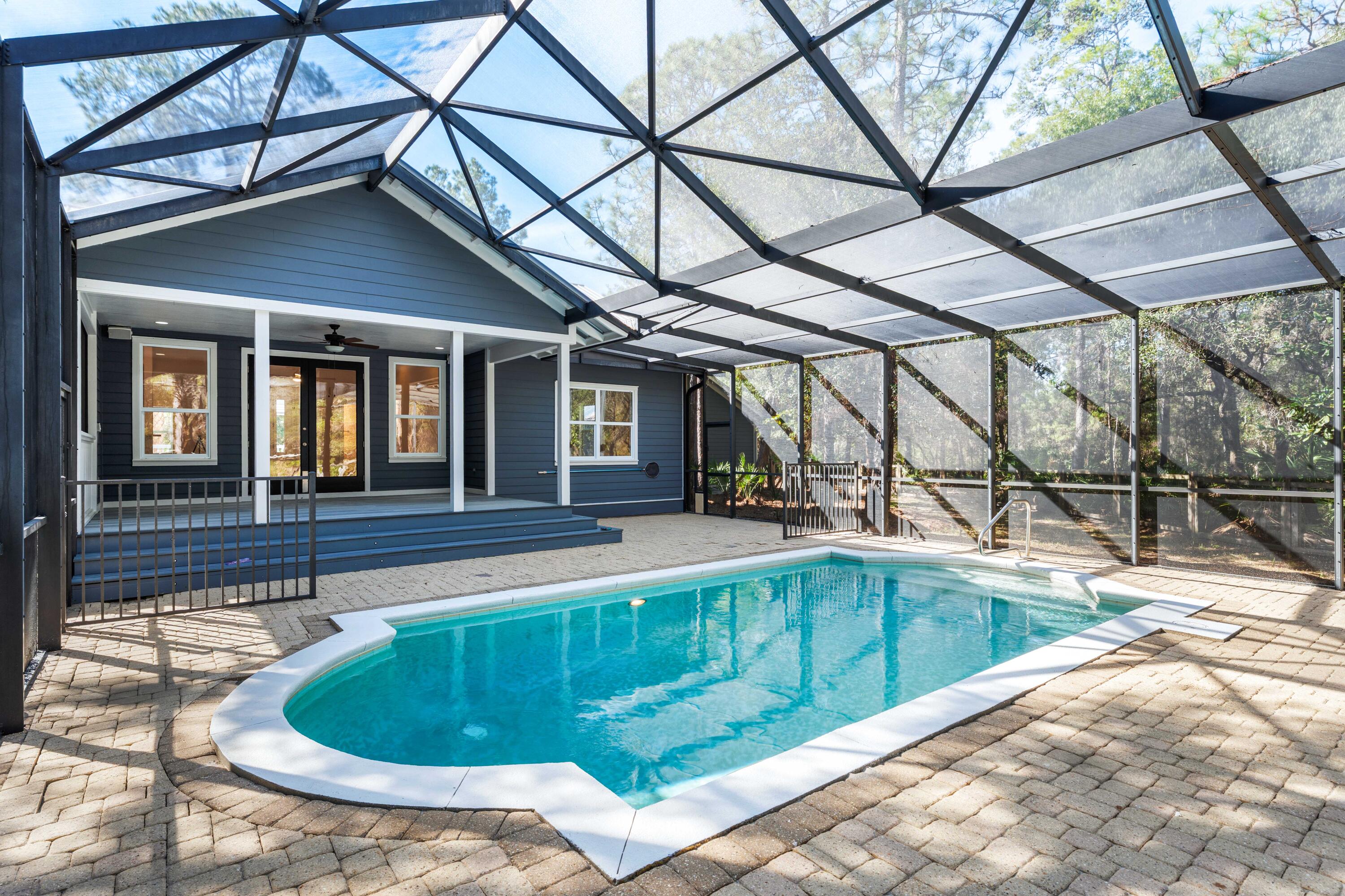 611 Amelia Lane Santa Rosa Beach, FL 32459 - Photo 48 of 59 a view of a house with a swimming pool